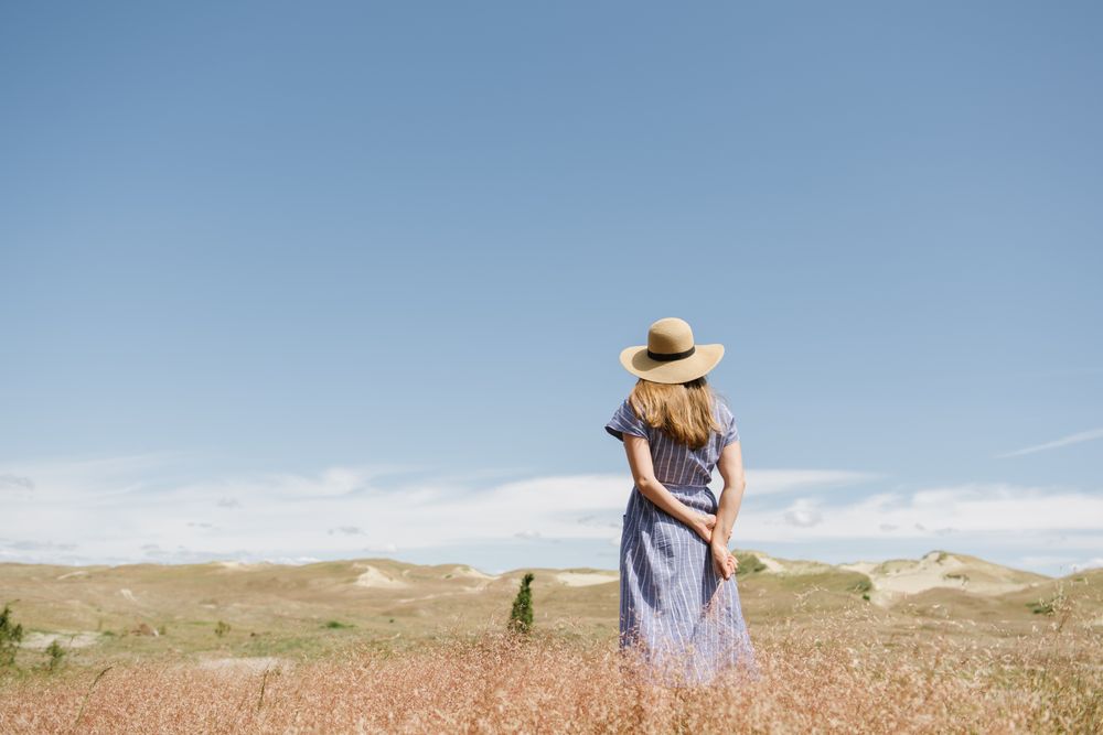 Young woman gathering dried spikes