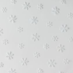 Winter snowflake pattern on light background