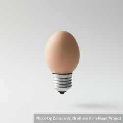Egg lightbulb on light background 4Ml9z5