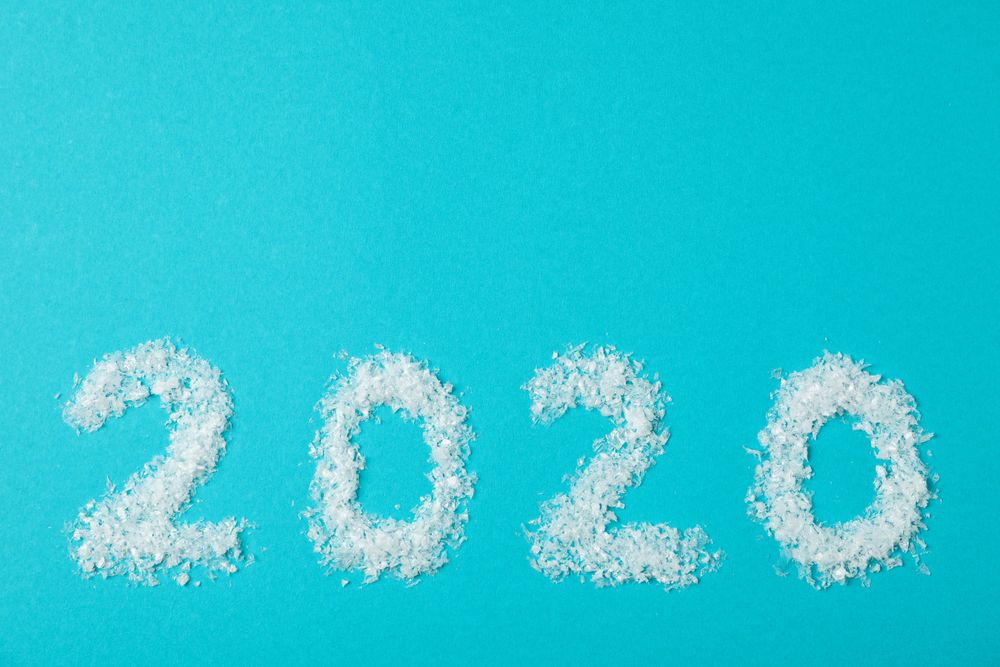2020 laid out of snow on turquoise background, copy space