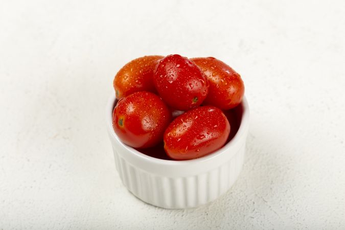 Fresh tomatoes in ramekin