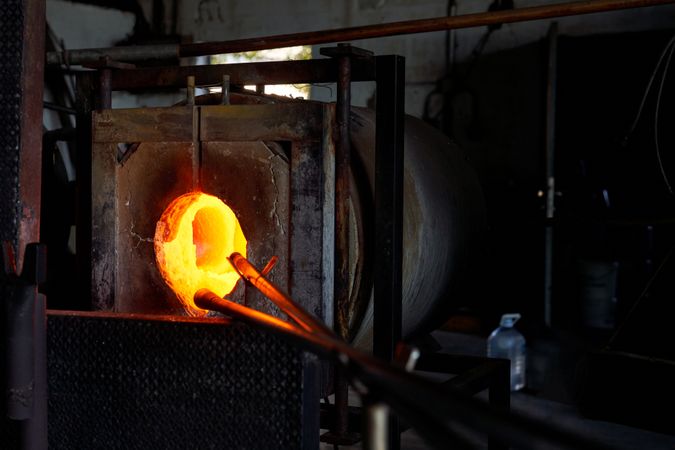 Glass being melted in furnace at workshop