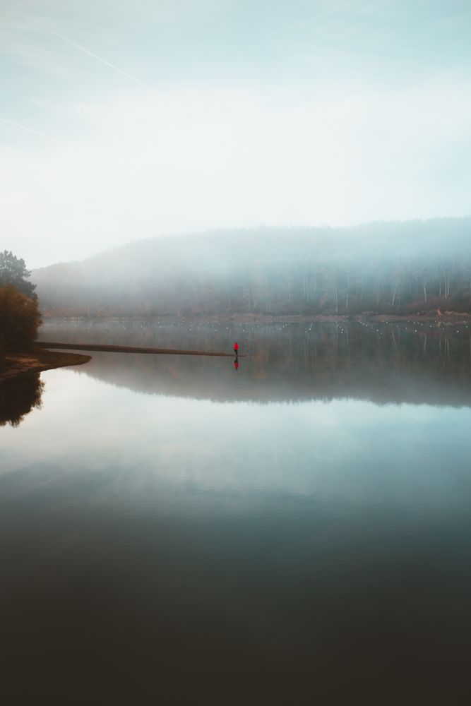 Beautiful tranquil lake in fog