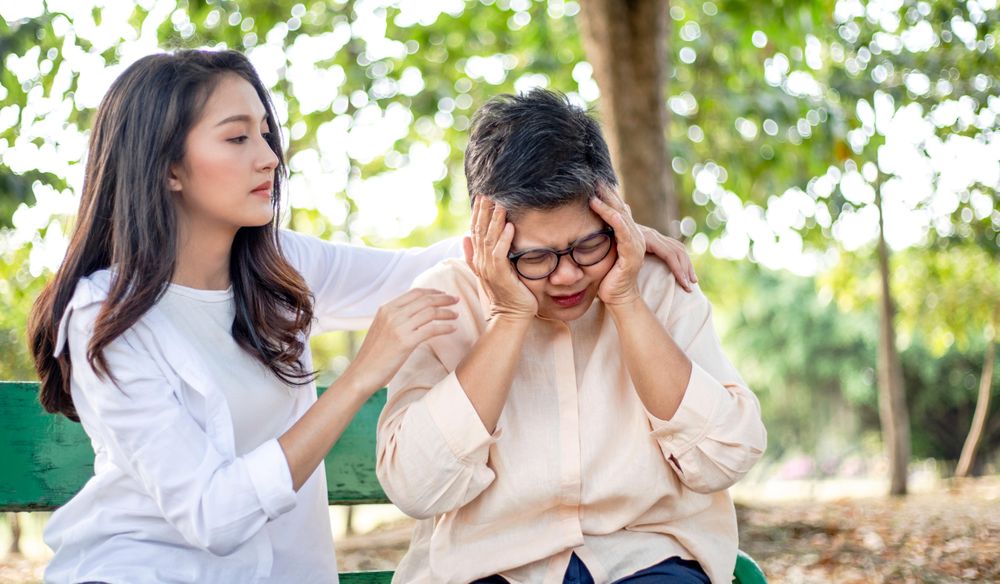 Daughter caring for distressed older woman