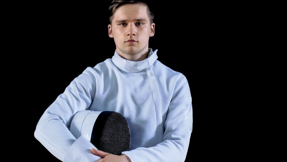 Portrait Shot of a Young Fencer Standing and Looking into Camera.