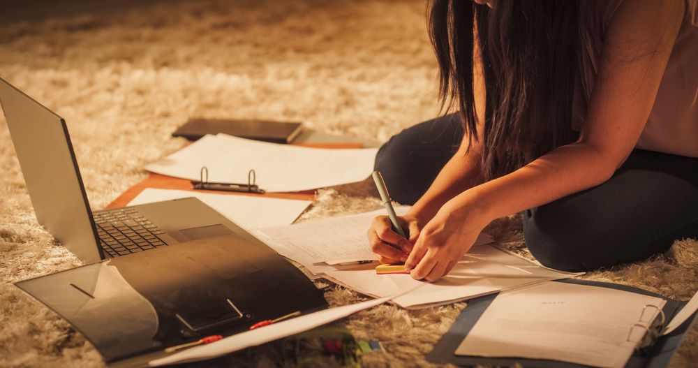 Close Up on Hands of Female Studying at Home: Engaged in Learning, Researching, and Project Management.