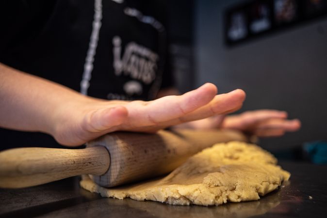 Person rolling a dough