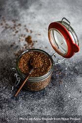 Flax seeds in pot with spoon bYqnj9