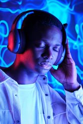 Dreaming Black man listening to music in headset