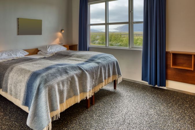 Comfortable hotel room with rural view from window