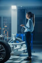 Automotive Design Engineer Thinking About Electric Car Chassis Prototype.