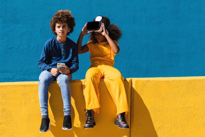 Black teenagers using modern gadgets