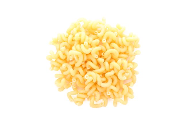 Pasta isolated on light background, top view. Traditional shape of dry uncooked whole pasta