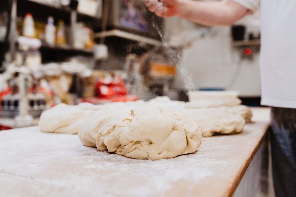 Tray with pig shaped desserts in bakery