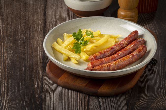 Grilled German sausage with french fries.