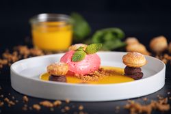 Raspberry ice cream with curable oranges chocolate and puff pastry