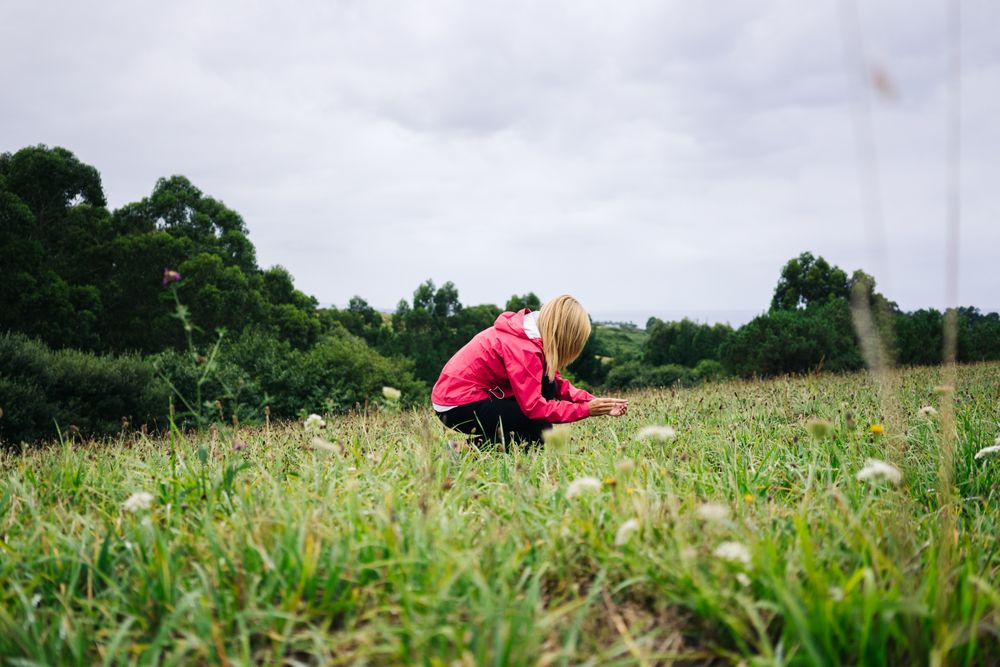 Cheerful woman enjoying countryside landscape