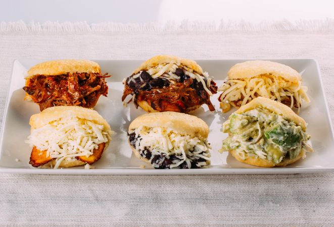 Latin American breakfast, specifically in countries such as Venezuela and Colombia, Arepas with several ingredients to fill like chicken, meat, avocado, cheese
