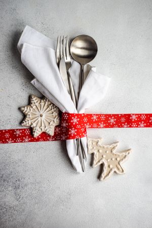 Christmas cutlery wrapped in red ribbon