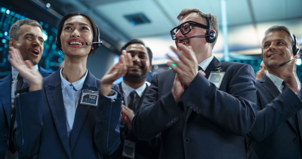 Group of Successful Stock Exchange Brokers Celebrating a Profitable Investment Bid on a Securities Market.