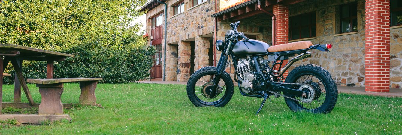 Custom motorcycle parked on the grass
