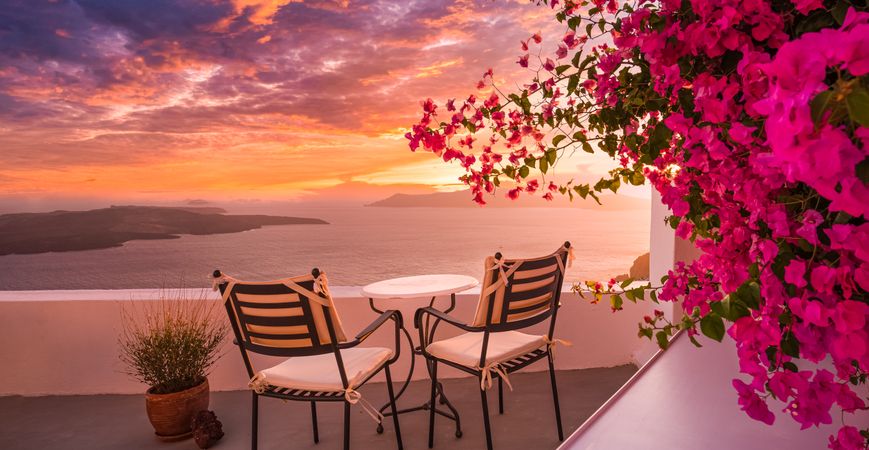 A relaxing place to sit in patio chairs to watch sunset over the Aegean Sea