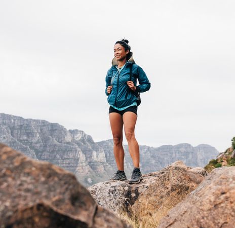 Happy hiking admiring view in the mountains