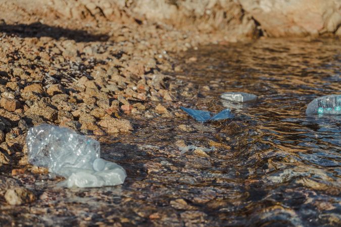 Plastic bottle lying on seashore