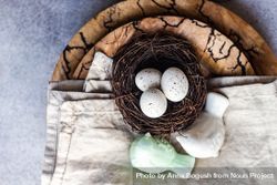 Top view of Easter table setting with bird figurine and nest on table 5oDQOm
