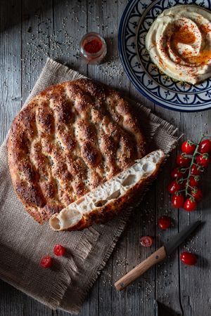 Ramazan pidesi near spices and tomatoes