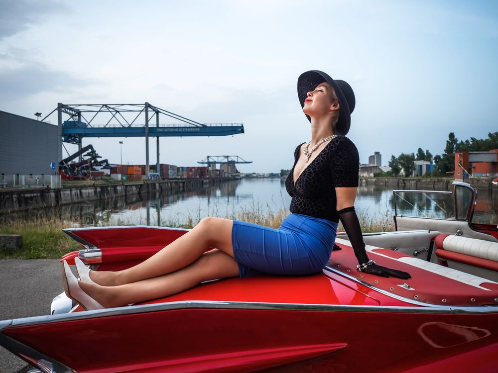 Retro red Cadillac with a woman