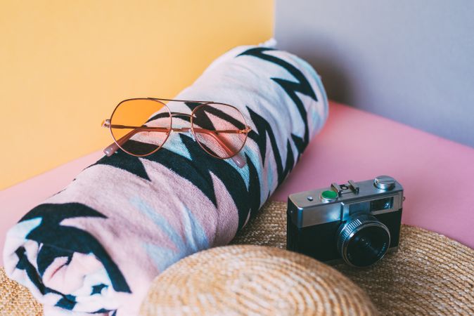 Summer trendy sunglasses, towel, hat and camera