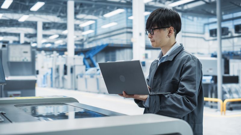 Asian man working with laptop