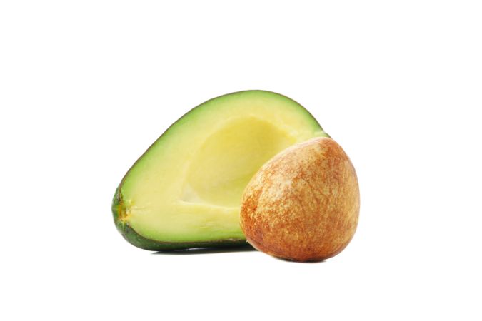 Ripe fresh avocado isolated on plain background