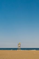 Observation tower at empty seashore