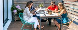 People working on the terrace of the office