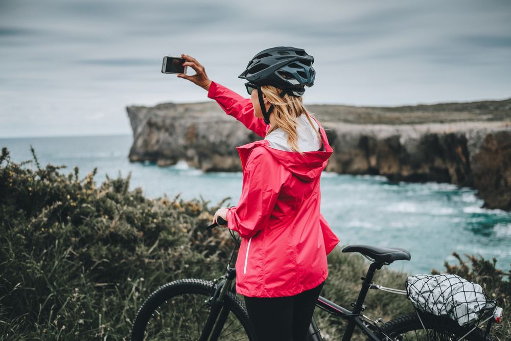 Female taking photos on cliffs