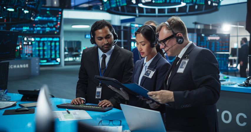 Team of Multiethnic Male and Female Traders Working in a Modern Stock Exchange Company.