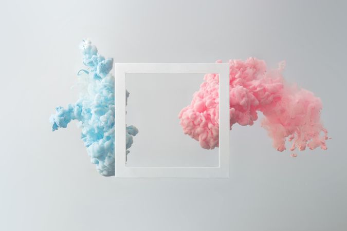 Cloud-like pastel pink and blue color paint with light frame on light background
