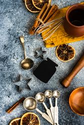 Christmas cookie baking equipment on stone background