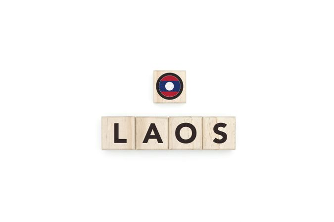 Wooden blocks bearing the name and flag of Laos.