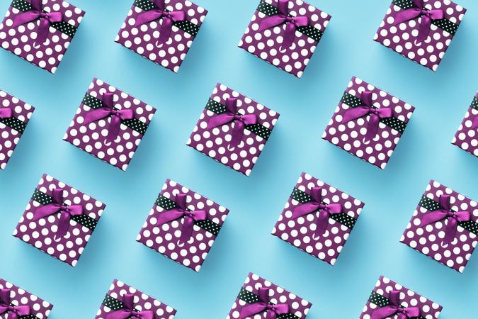 Purple dotted presents over aqua background