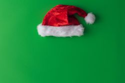 Santa hat on green background
