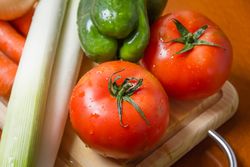 Fresh vegetables on cutting board in the kitchen