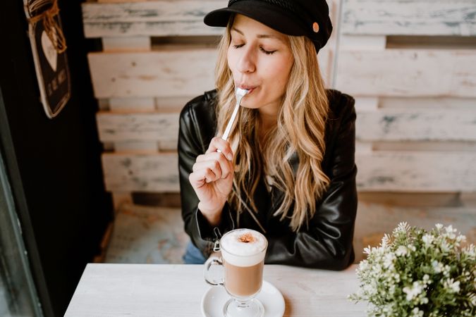 Woman drinking coffee from a glass