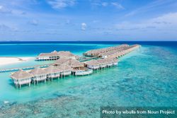 Overwater bungalows in a Maldives beach resort bYVjg0