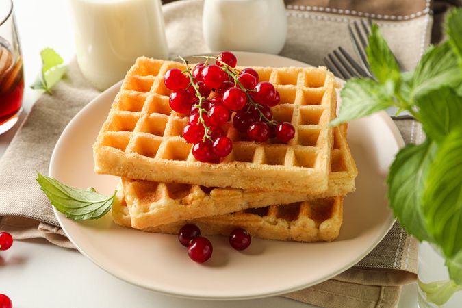 Beautiful composition with sweet waffles, closeup
