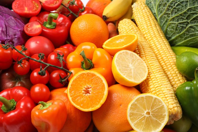 Ripe vegetables and fruits on whole background, close up