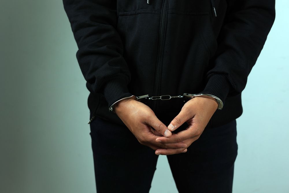 Man in Jacket  in Handcuffs