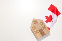 A wooden house with the flag of Canada
